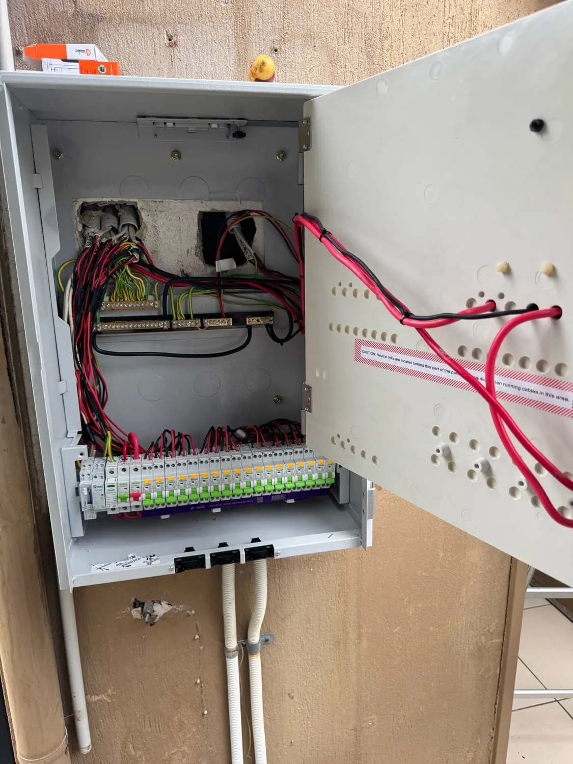 A new labelled switchboard with the door open