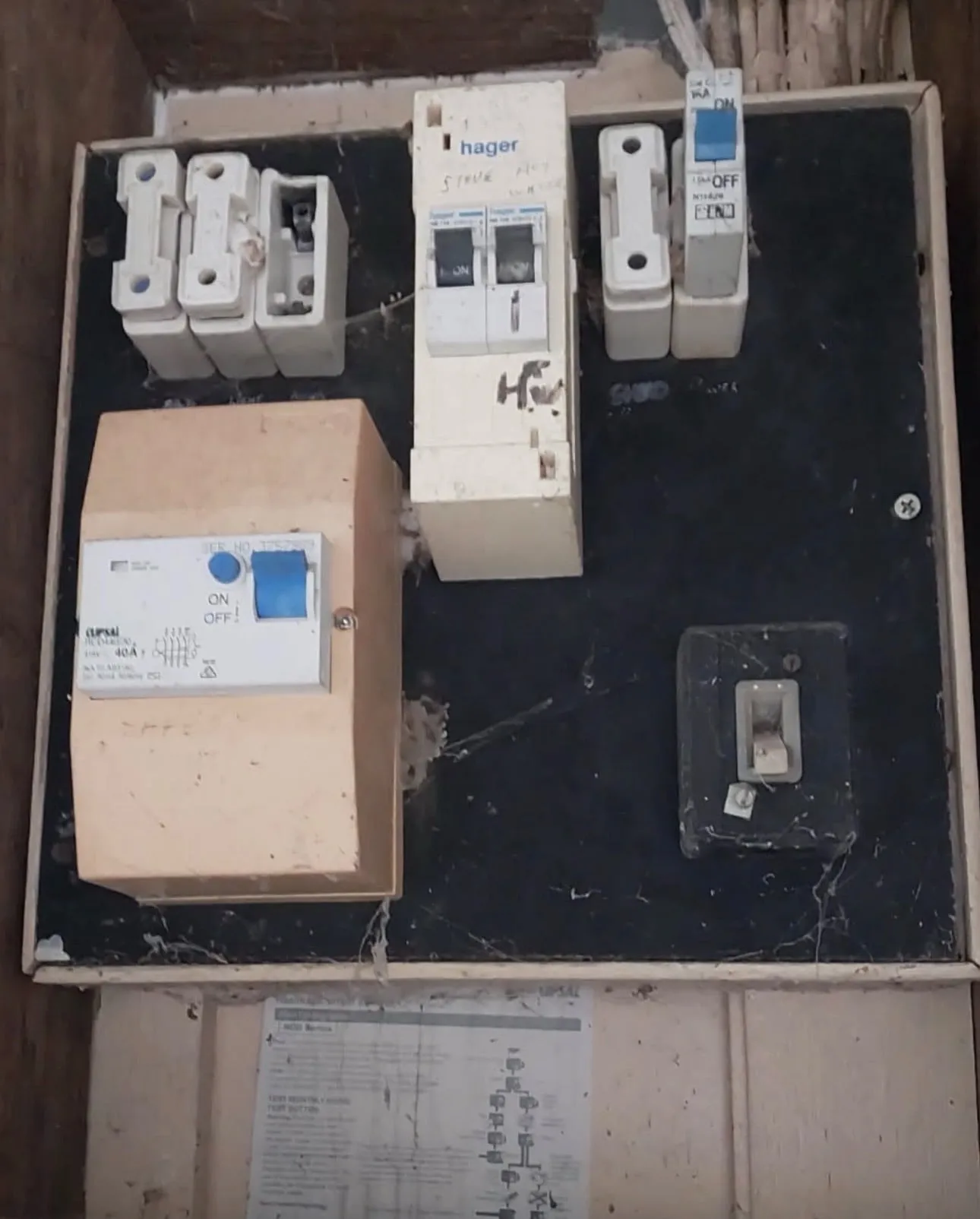 An old switchboard with ceramic fuses